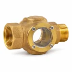Mirilla de inspección tipo visor de flujo en bronce con ventana transparente y conexiones roscadas para prueba y drenaje RCI | HIDRALCO Colombia